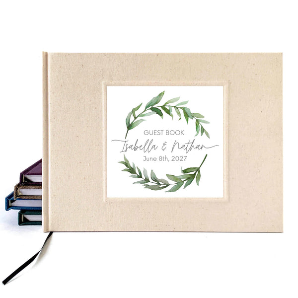 Cream linen bridal guest book with personalized watercolor wreath on the cover. Hardback, handcrafted.