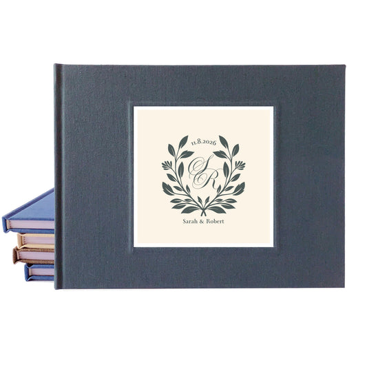 Custom wedding guest book with hardback dark gray linen cover and wedding monogram design for engaged couple