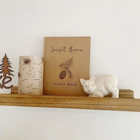 Custom-designed welcome book for guests, perfectly matching vacation home decor to create a warm and inviting atmosphere.