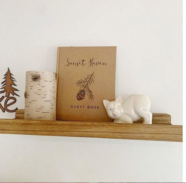 Custom-designed welcome book for guests, perfectly matching vacation home decor to create a warm and inviting atmosphere.