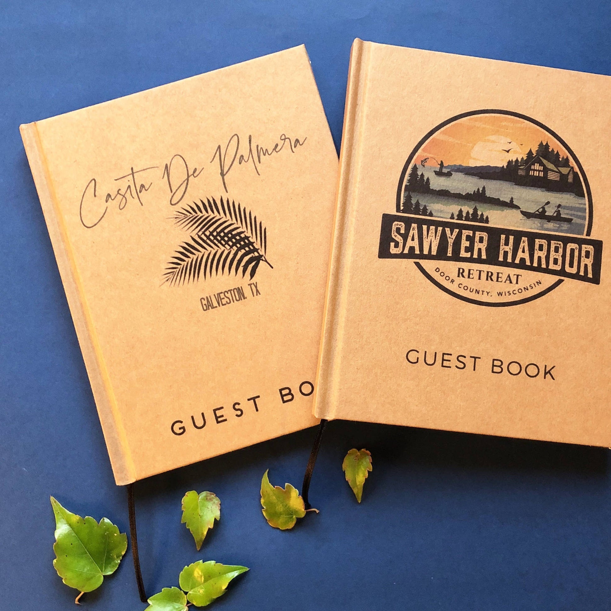 Two custom guest books on the table. Each has their own personalized logos on the front. High quality branding for your place or event.